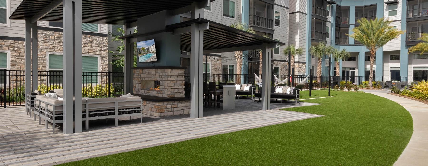 a building with a green lawn