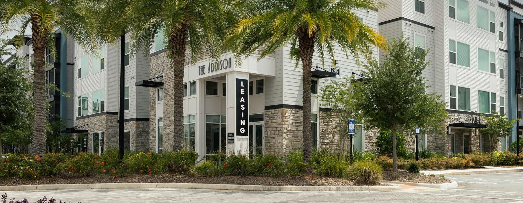 a building with palm trees