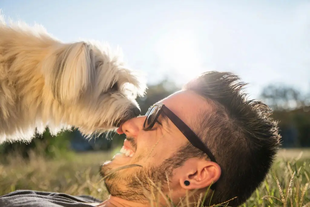 young man with dog on chest