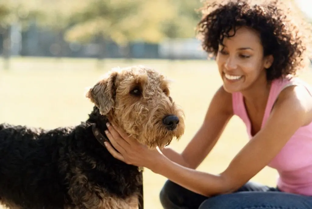 woman with dog, smiling