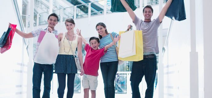 Happy family shopping together in mall