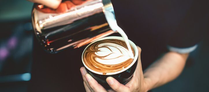 Barista making latte art.