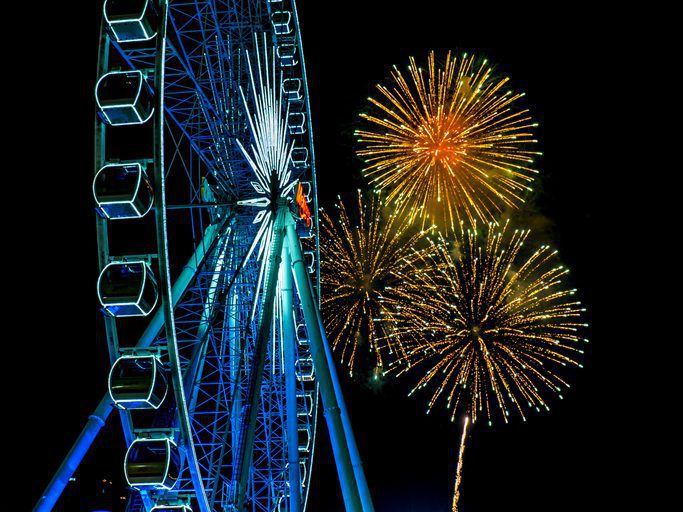 Ferris wheel illuminated at a carnival at night
